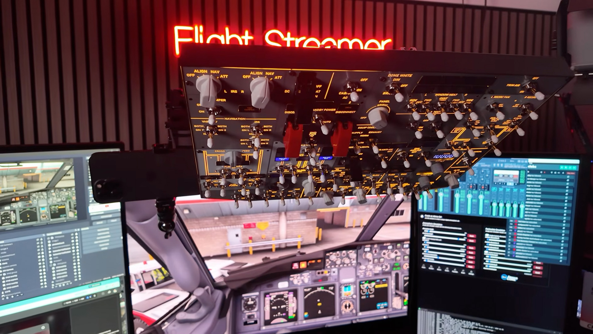 Rowsfire B107 overhead panel installed above the monitors in a Boeing 737 home cockpit setup