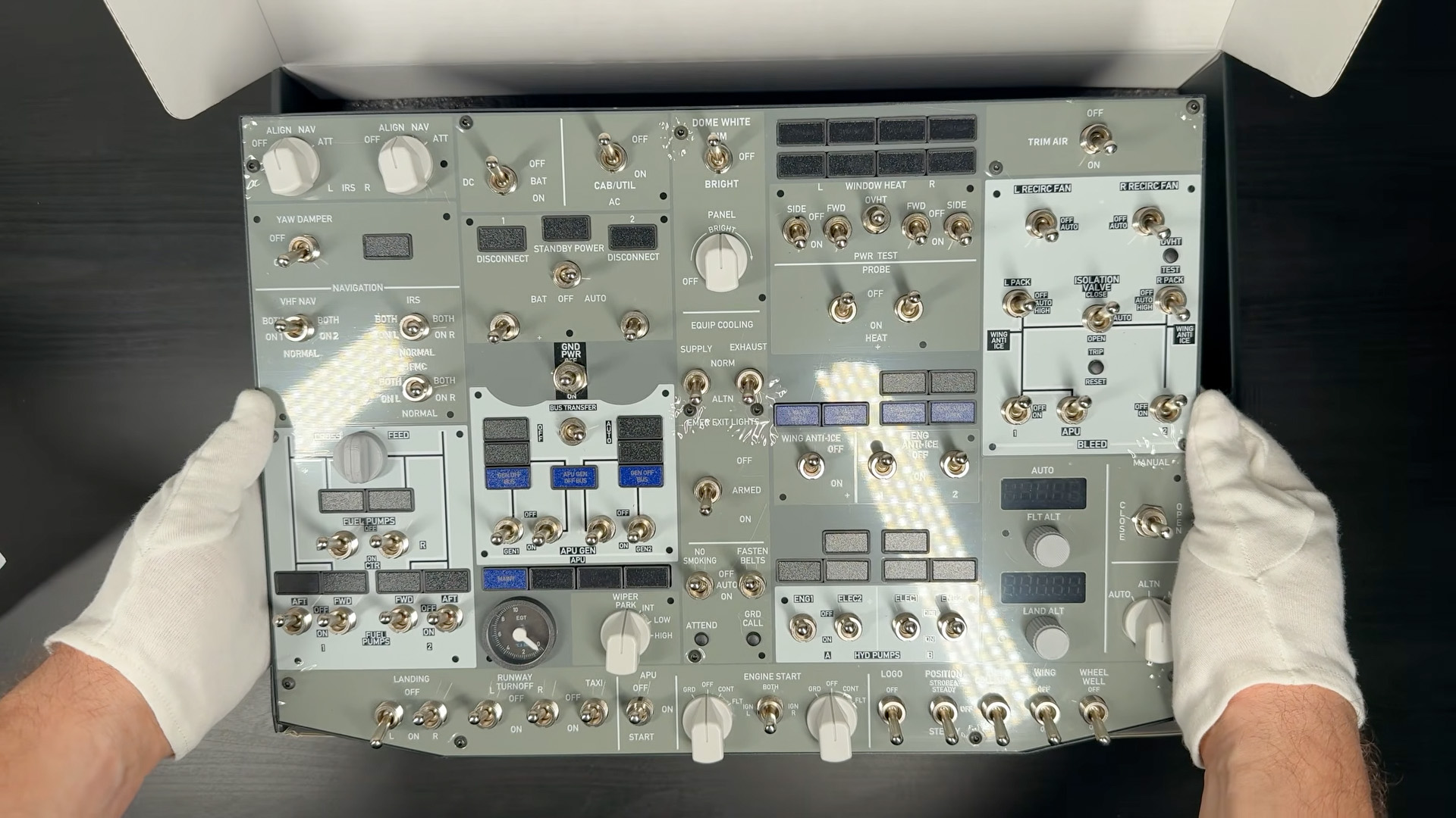 Rowsfire B107 Boeing 737 overhead panel shown from above with both hands holding the unit